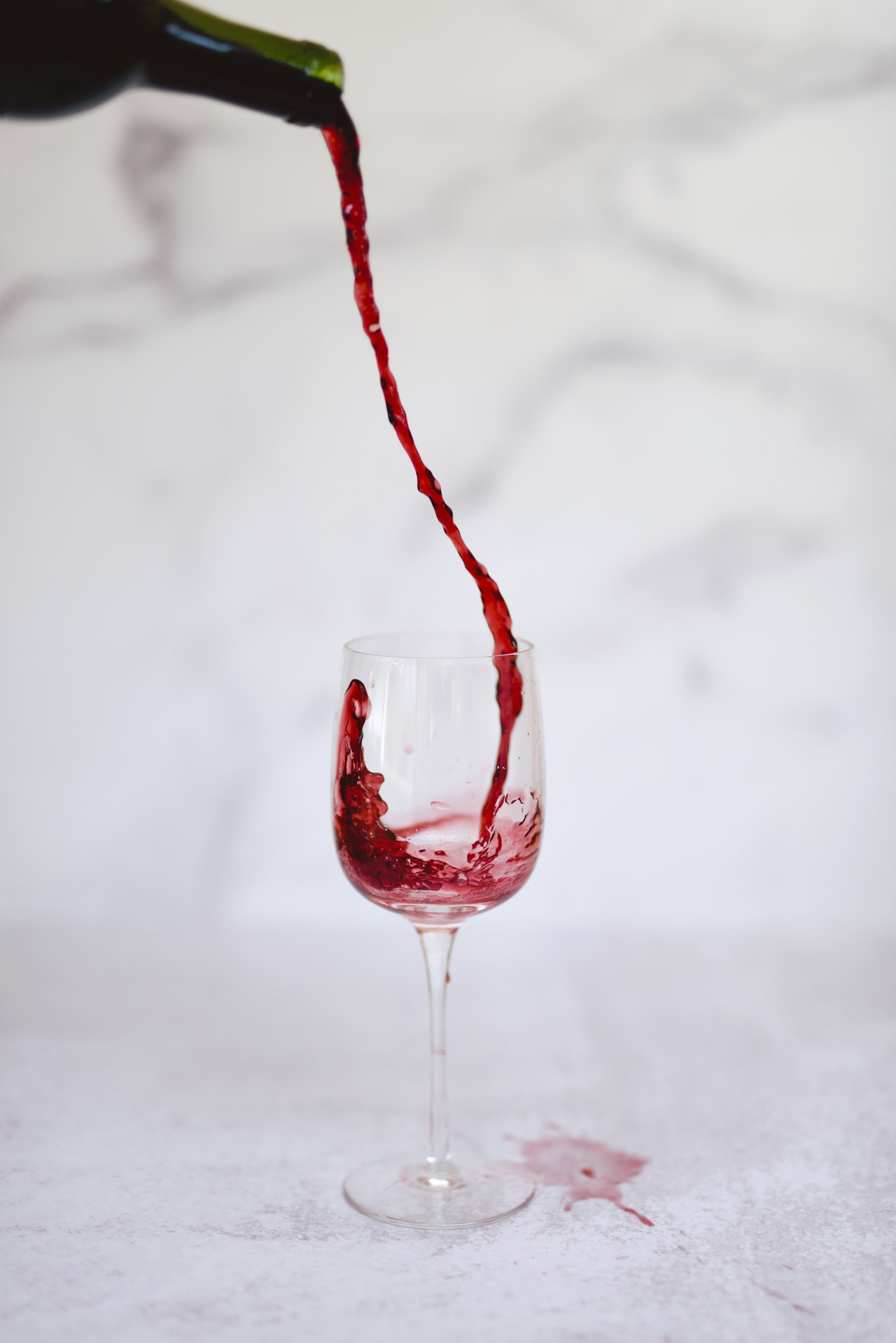 Red wine being poured into a wine glass