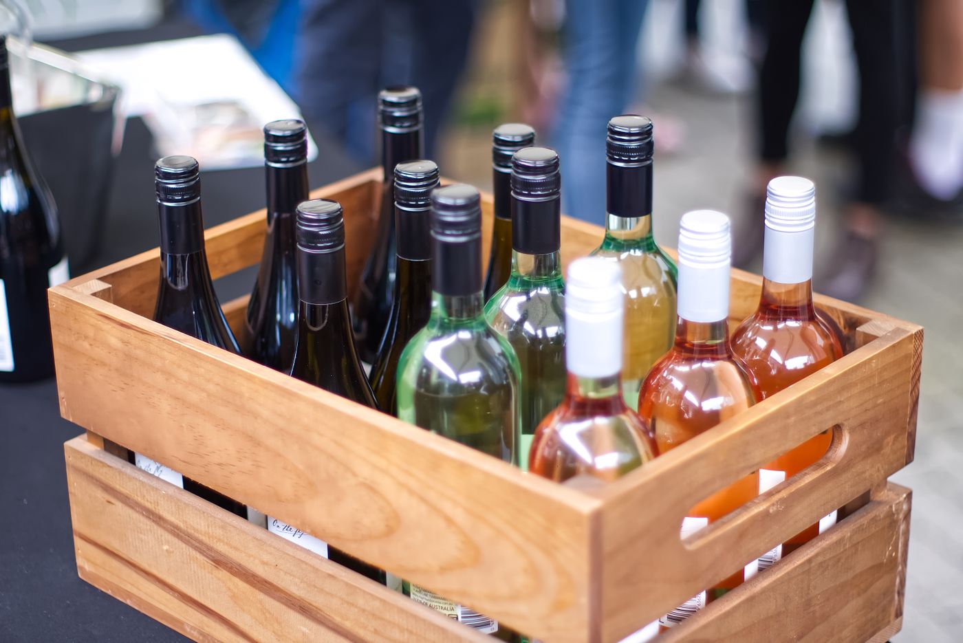 A wooden crate of wine bottles, the basis for an anniversary wine box wedding gift